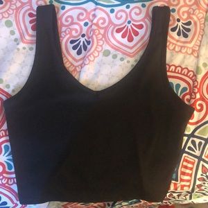 It is a cute crop tank, black, small, Actual size, highly recommend